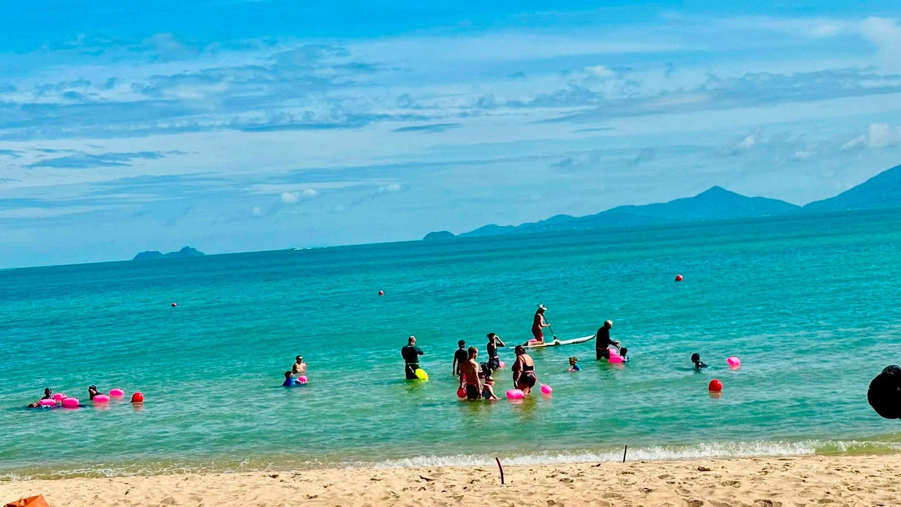 Sunday beach session swimmers in the sea