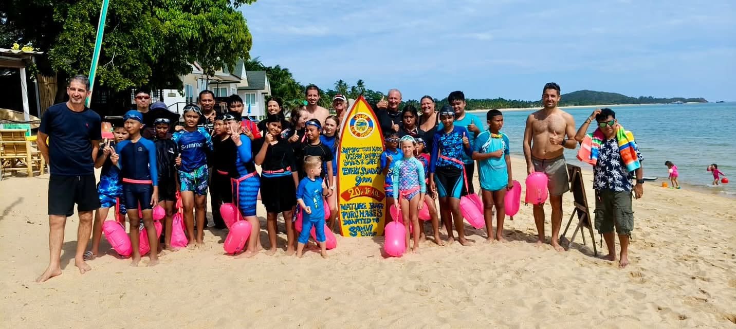 Sunday beach session group with rescue floats