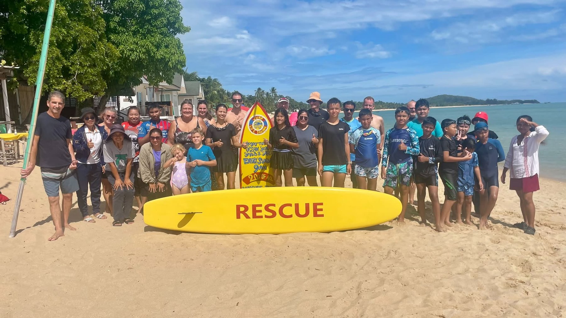 Children and volunteers with the club rescue board