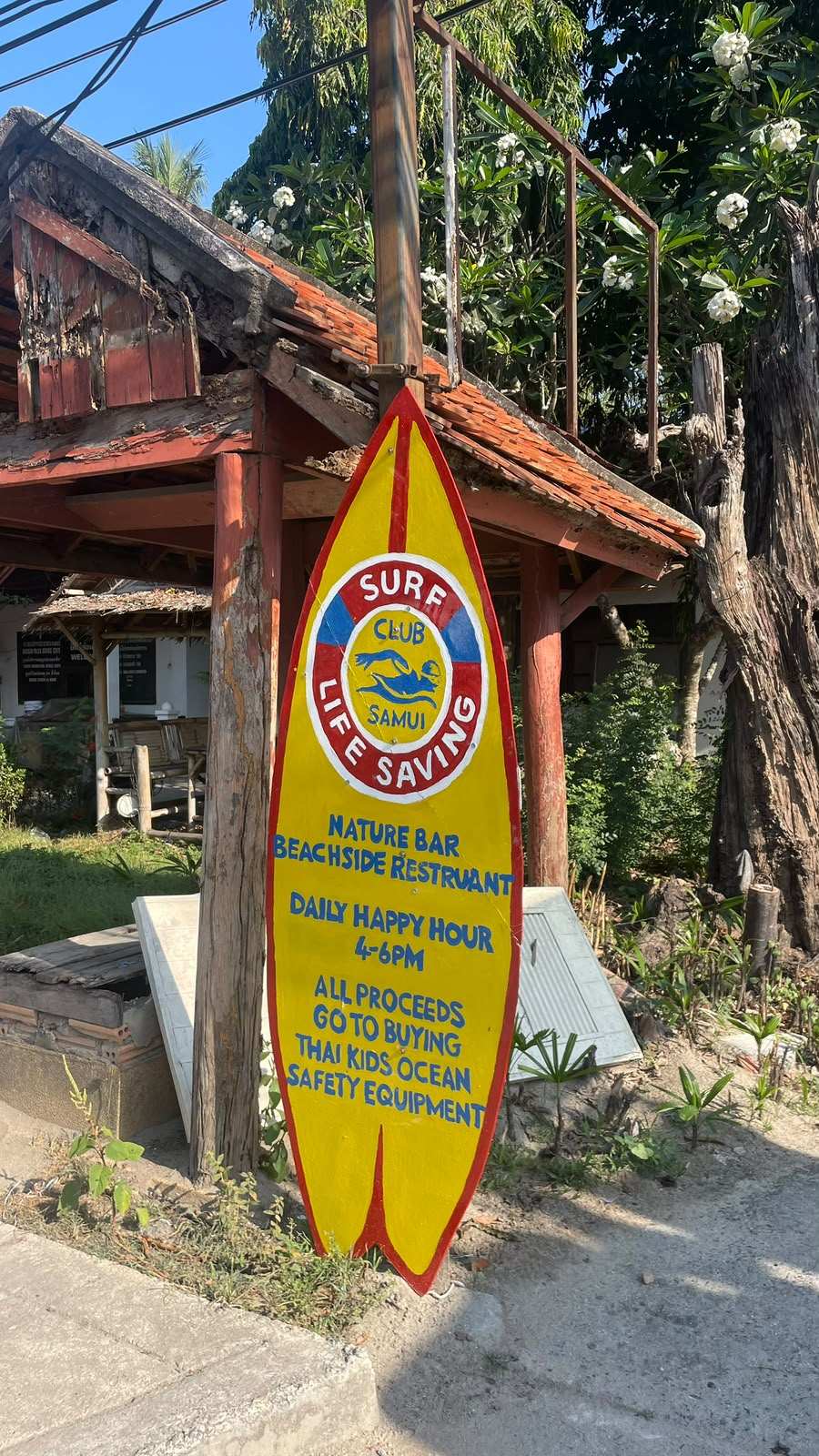 Hand-painted Surf Club surfboard sign at Nature Bar