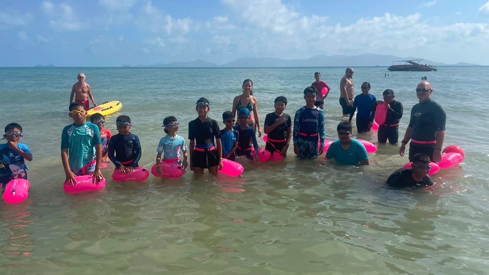 Group of local children with rescue floats during a Sunday Nippers session at Nature Bar, Mae Nam